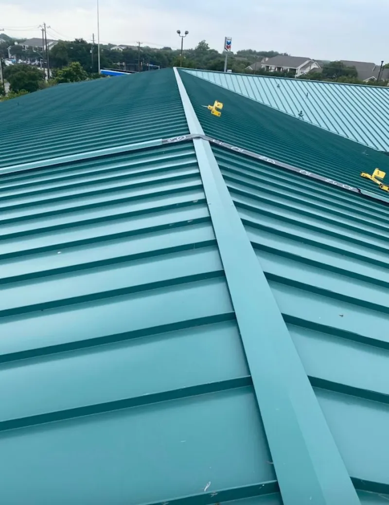Green commercial metal roof ridge and valley for Metal Roof Repair in Blue Springs